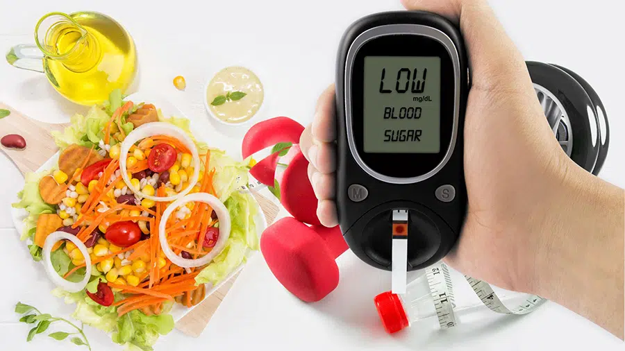 Un appareil pour contrôler le diabète au premier plan, avec des haltères de sport et un repas équilibré en fond.
