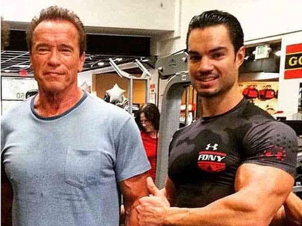 Sports coach and former professional bodybuilder Julien Quaglierini alongside bodybuilding champion Arnold Schwarzenegger.