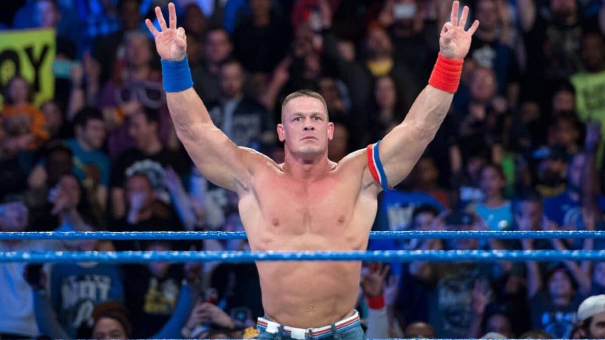 Shirtless wrestler John Cena in a ring.